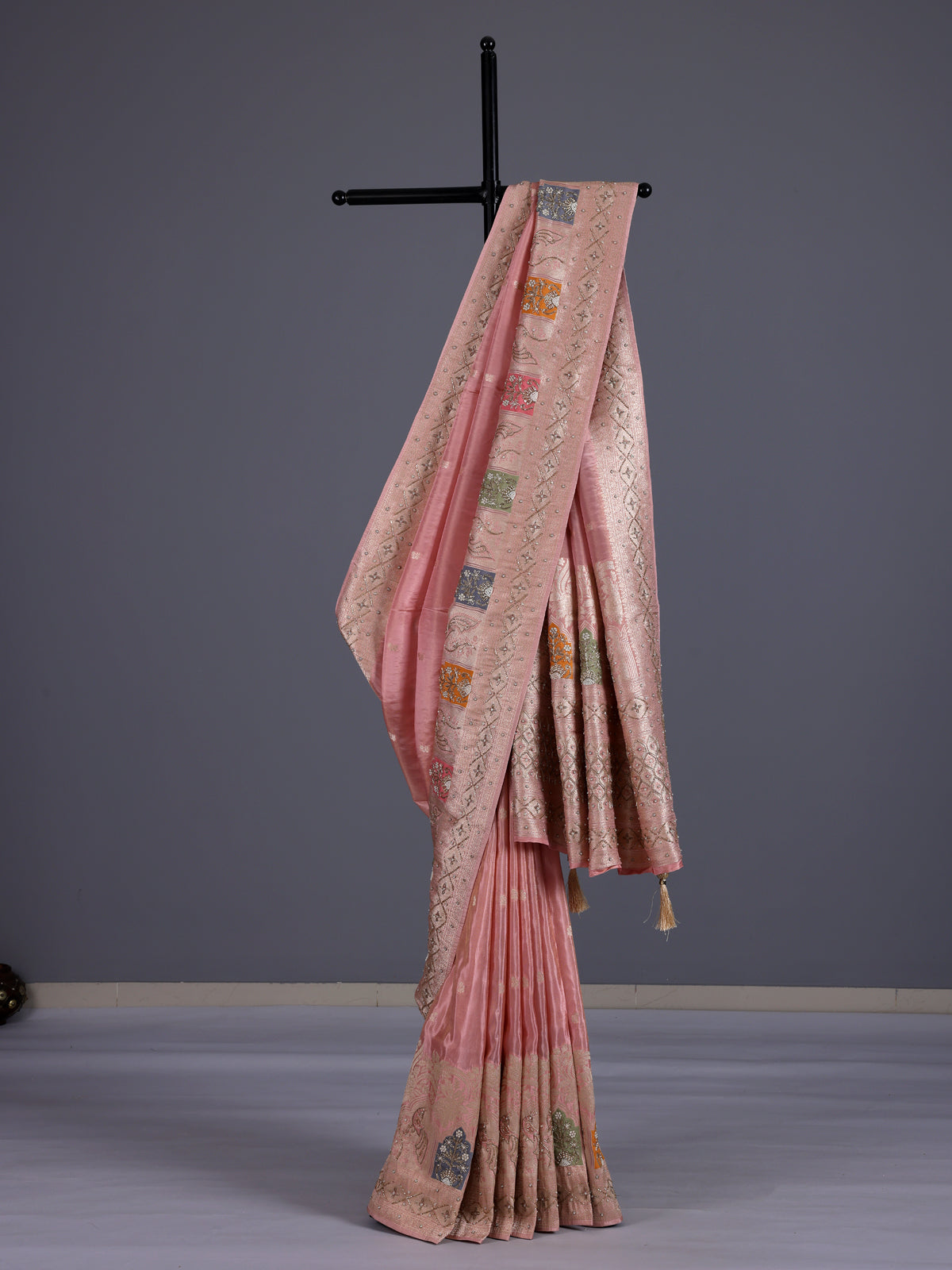 Pink silk saree with graceful peacock motif embellishments
