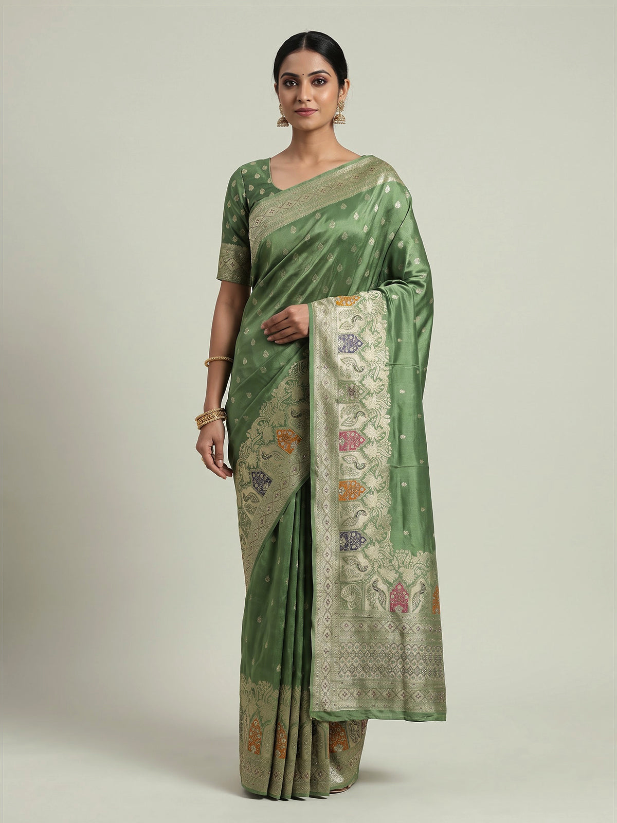 Pista green silk saree with elegant peacock motif embellishments