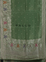 Pista green silk saree with elegant peacock motif embellishments