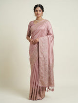 Onion pink silk saree with graceful traditional pallu tassels