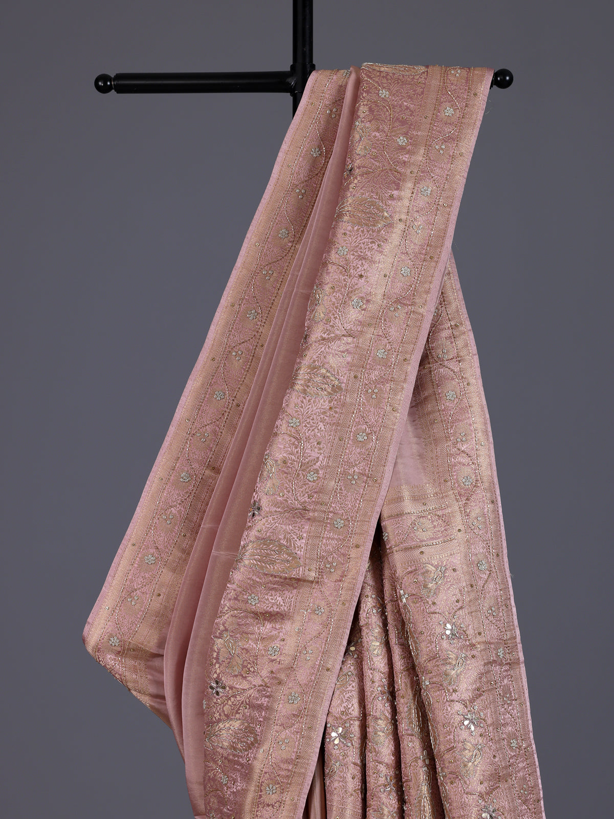 Onion pink silk saree with graceful traditional pallu tassels