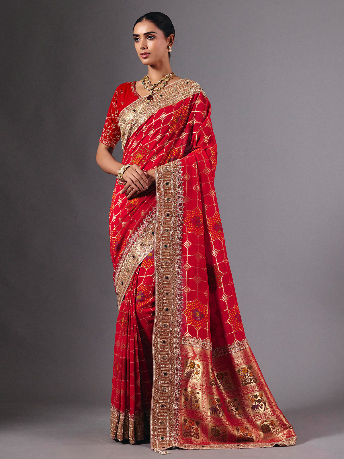 Radiant red georgette saree with zari animal motif embellishments