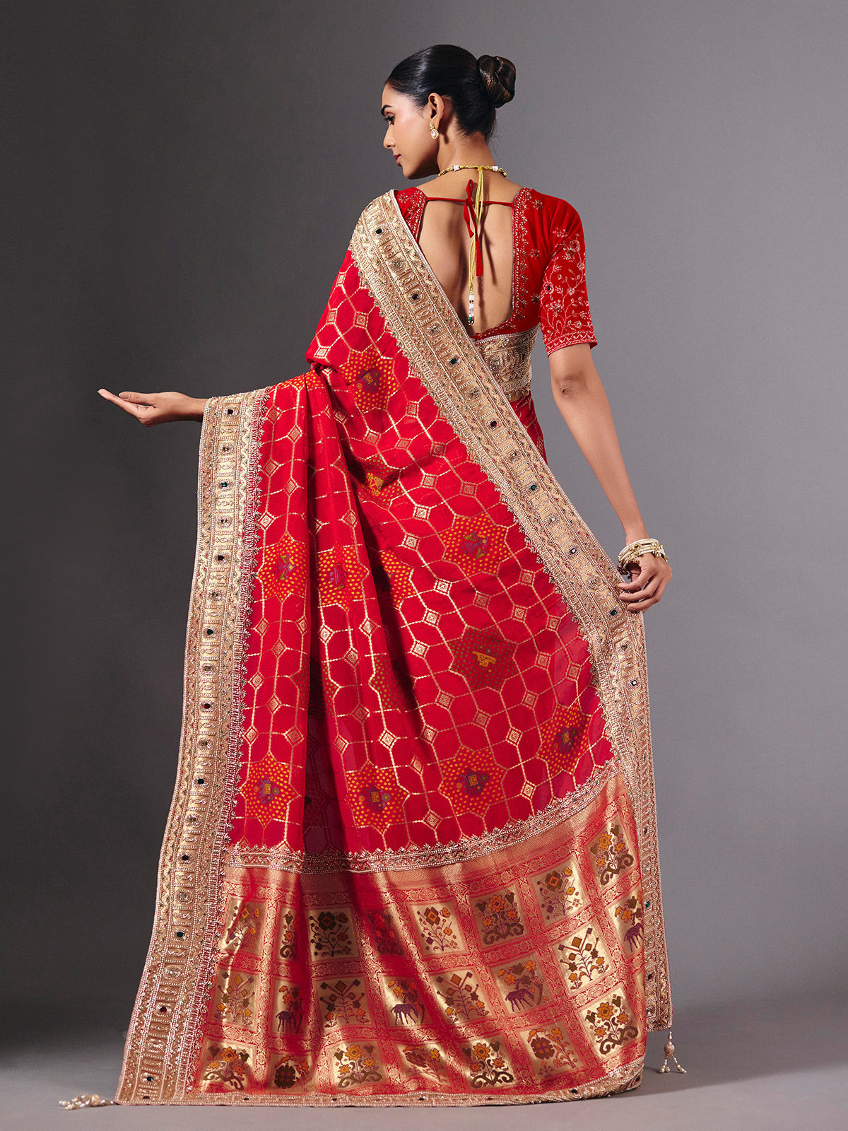 Radiant red georgette saree with zari animal motif embellishments