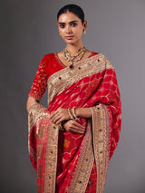 Radiant red georgette saree with zari animal motif embellishments
