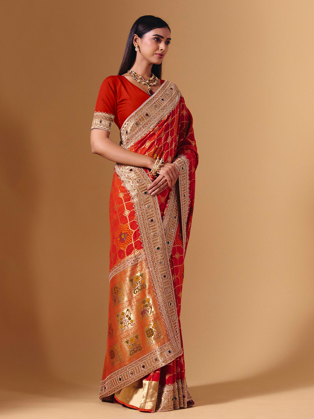 Orange georgette saree with sparkling animal motif detailing