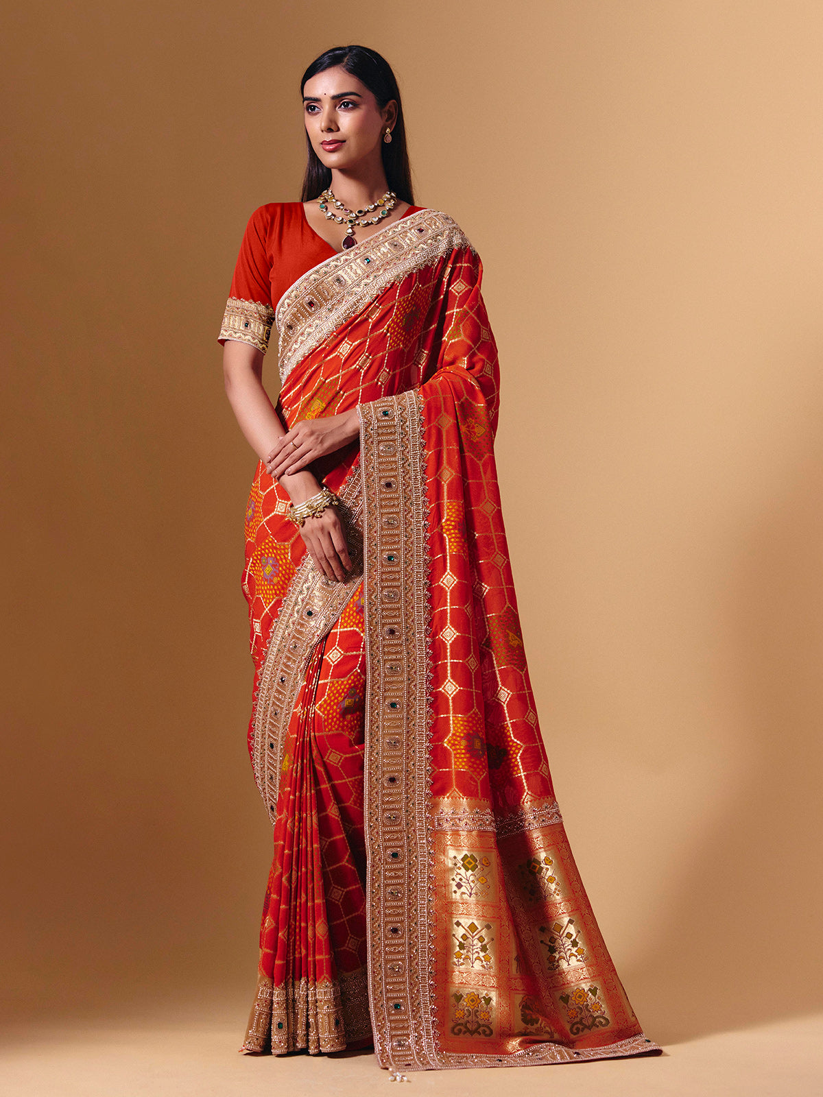Orange georgette saree with sparkling animal motif detailing