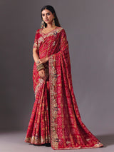 Maroon gharchola silk saree with peacock motif embellishments
