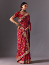 Maroon gharchola silk saree with peacock motif embellishments