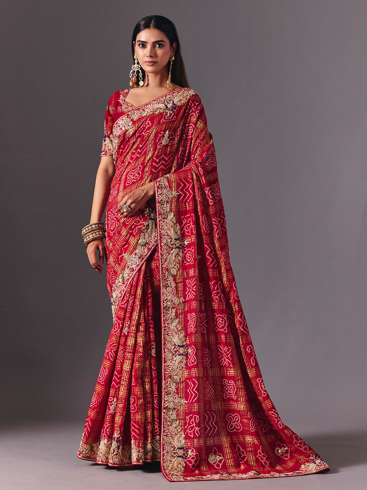 Maroon gharchola silk saree with peacock motif embellishments