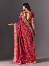 Maroon gharchola silk saree with peacock motif embellishments
