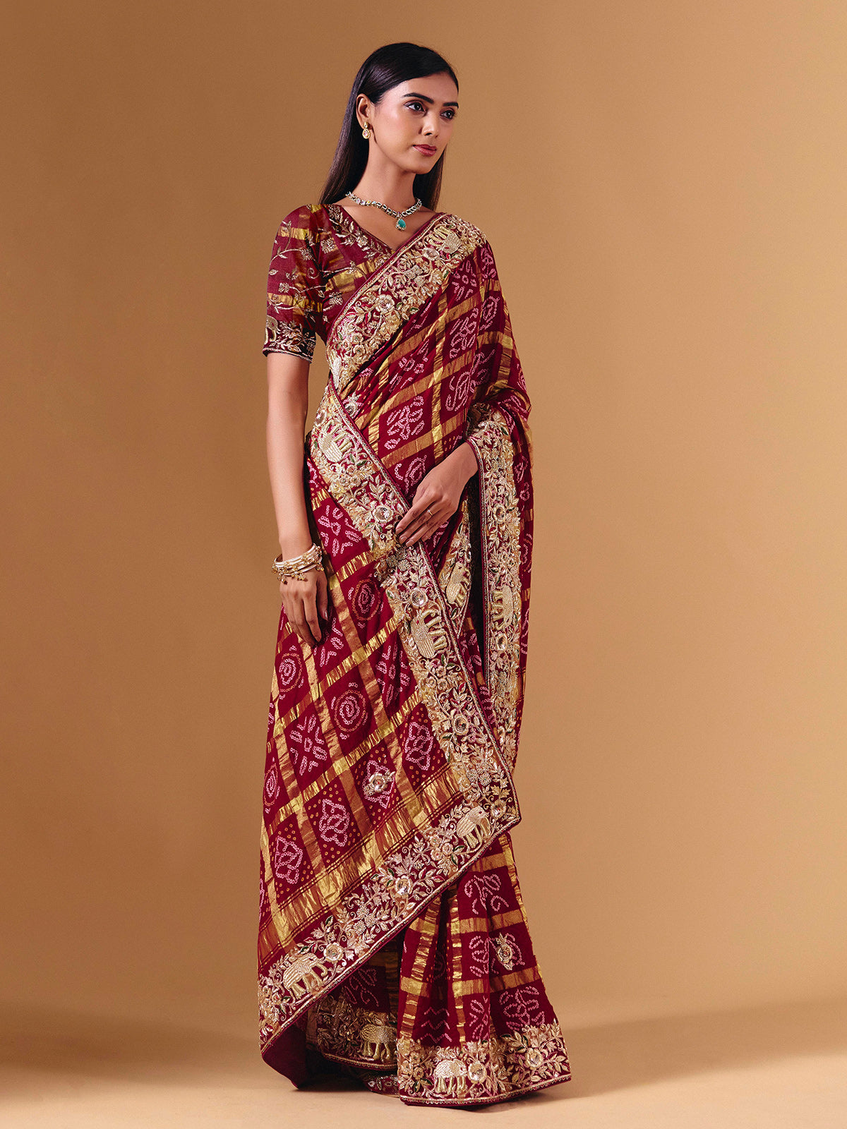 Maroon gharchola silk saree with elephant motif artistry