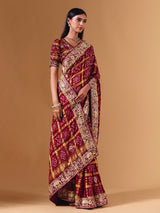 Maroon gharchola silk saree with elephant motif artistry