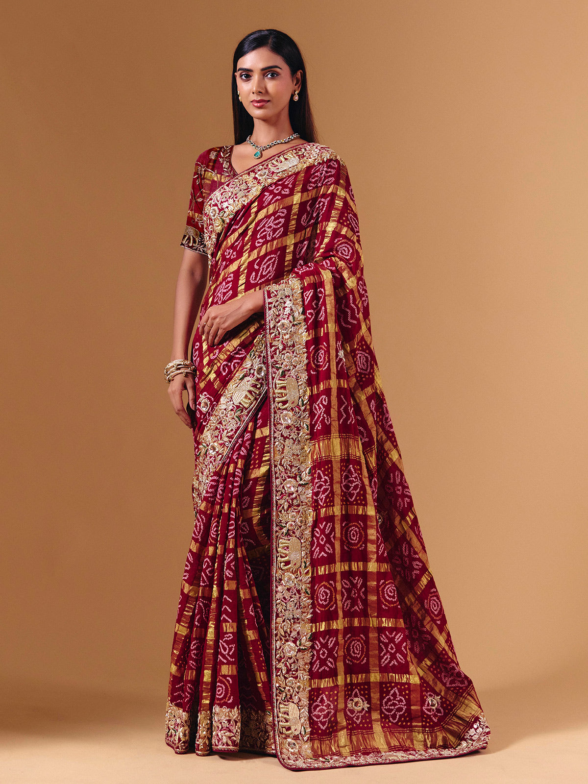 Maroon gharchola silk saree with elephant motif artistry