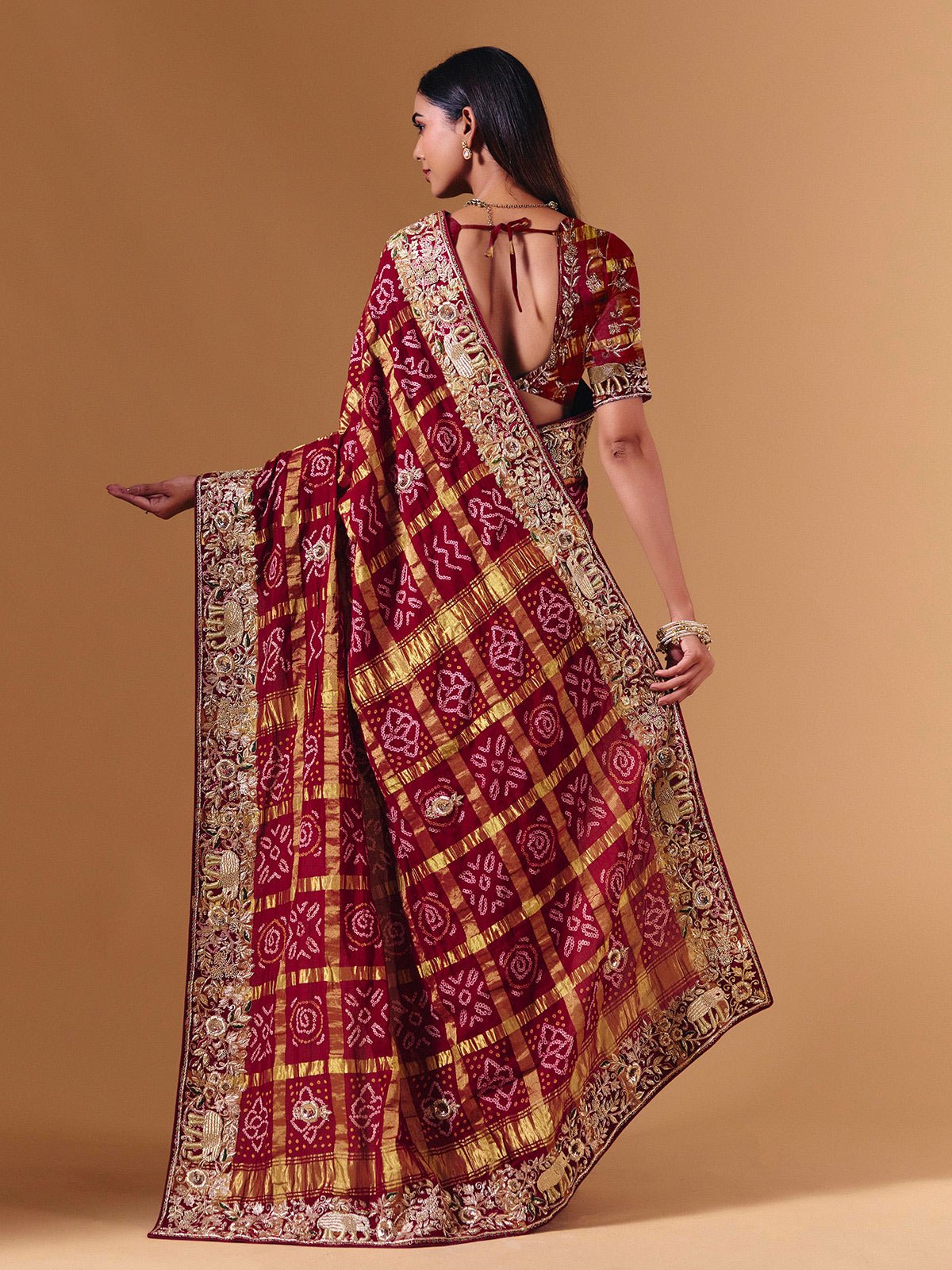 Maroon gharchola silk saree with elephant motif artistry