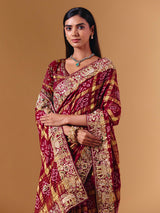 Maroon gharchola silk saree with elephant motif artistry