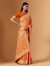Orange georgette saree with bandhani print and zardosi embellishments