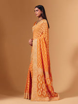 Orange georgette saree with bandhani print and zardosi embellishments