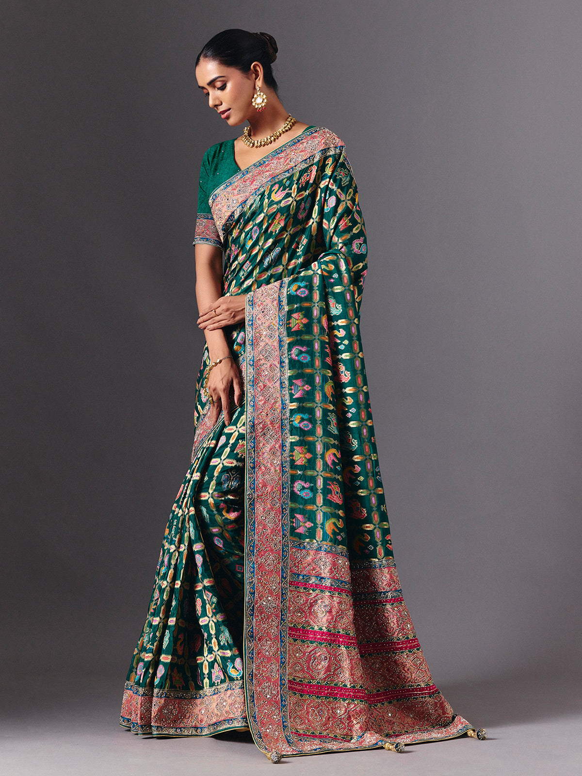 Rama green modal silk saree with mirror animal motif detailing