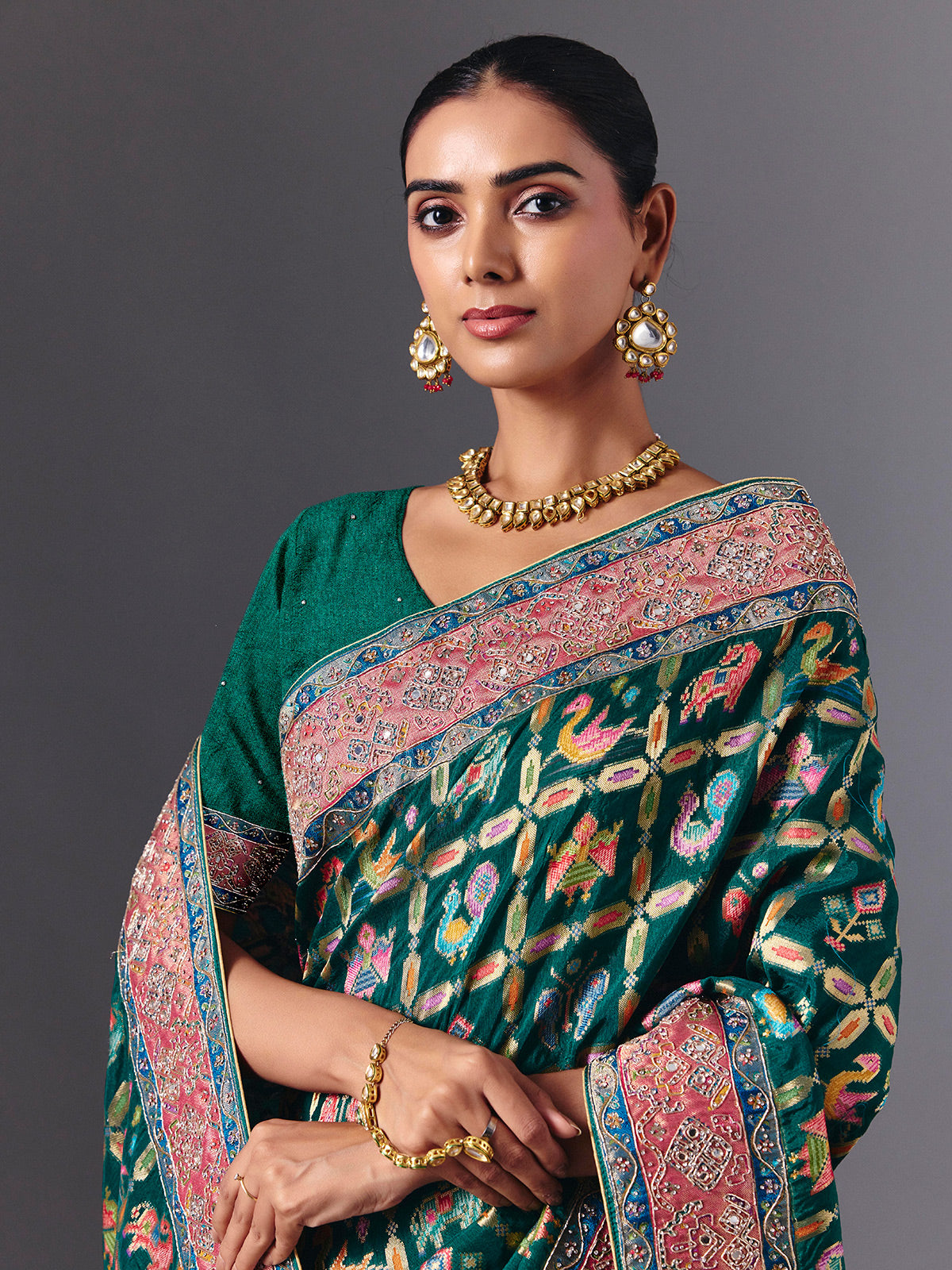 Rama green modal silk saree with mirror animal motif detailing