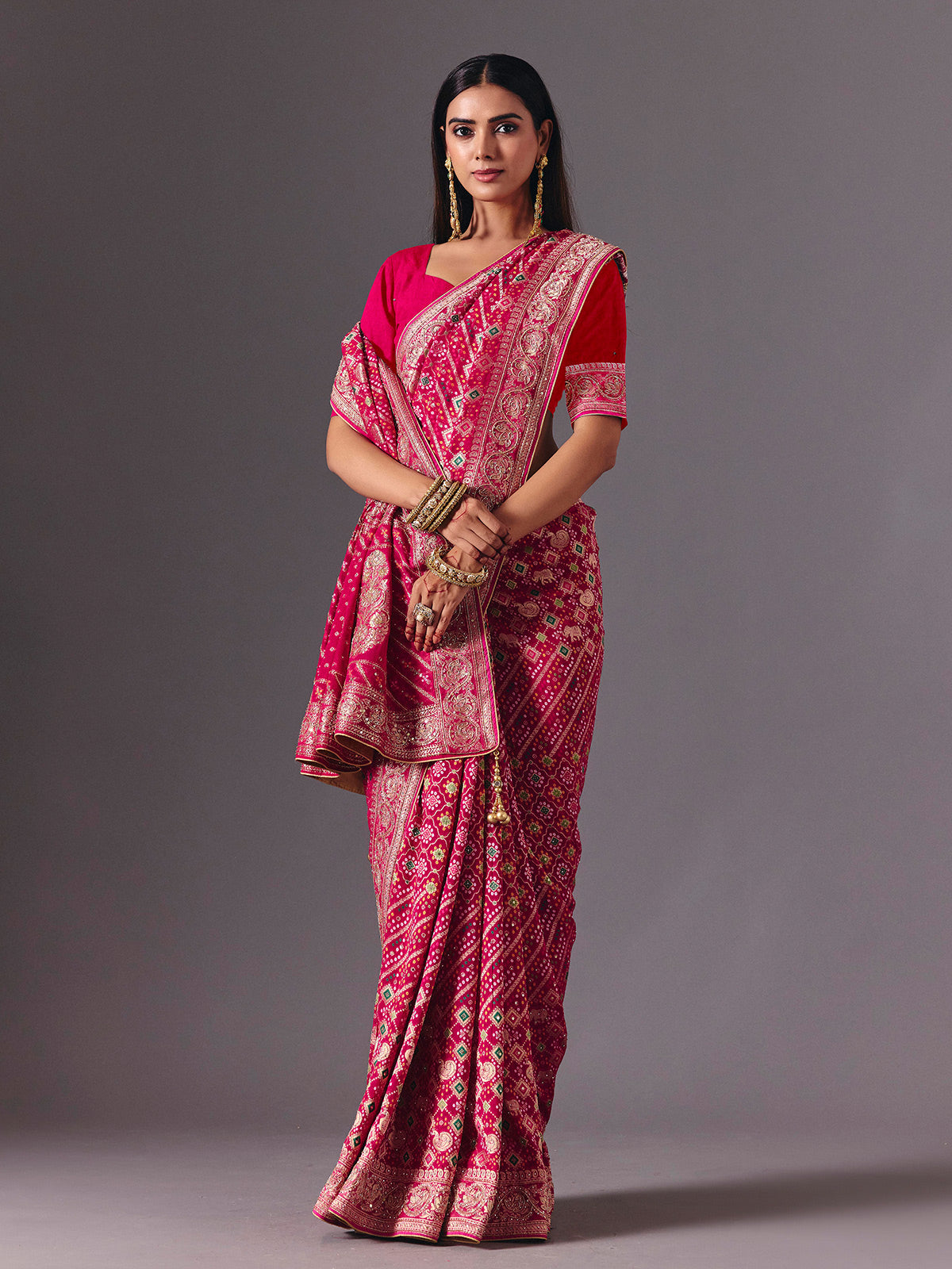 Rani pink dola silk saree with bandhani zari elegance
