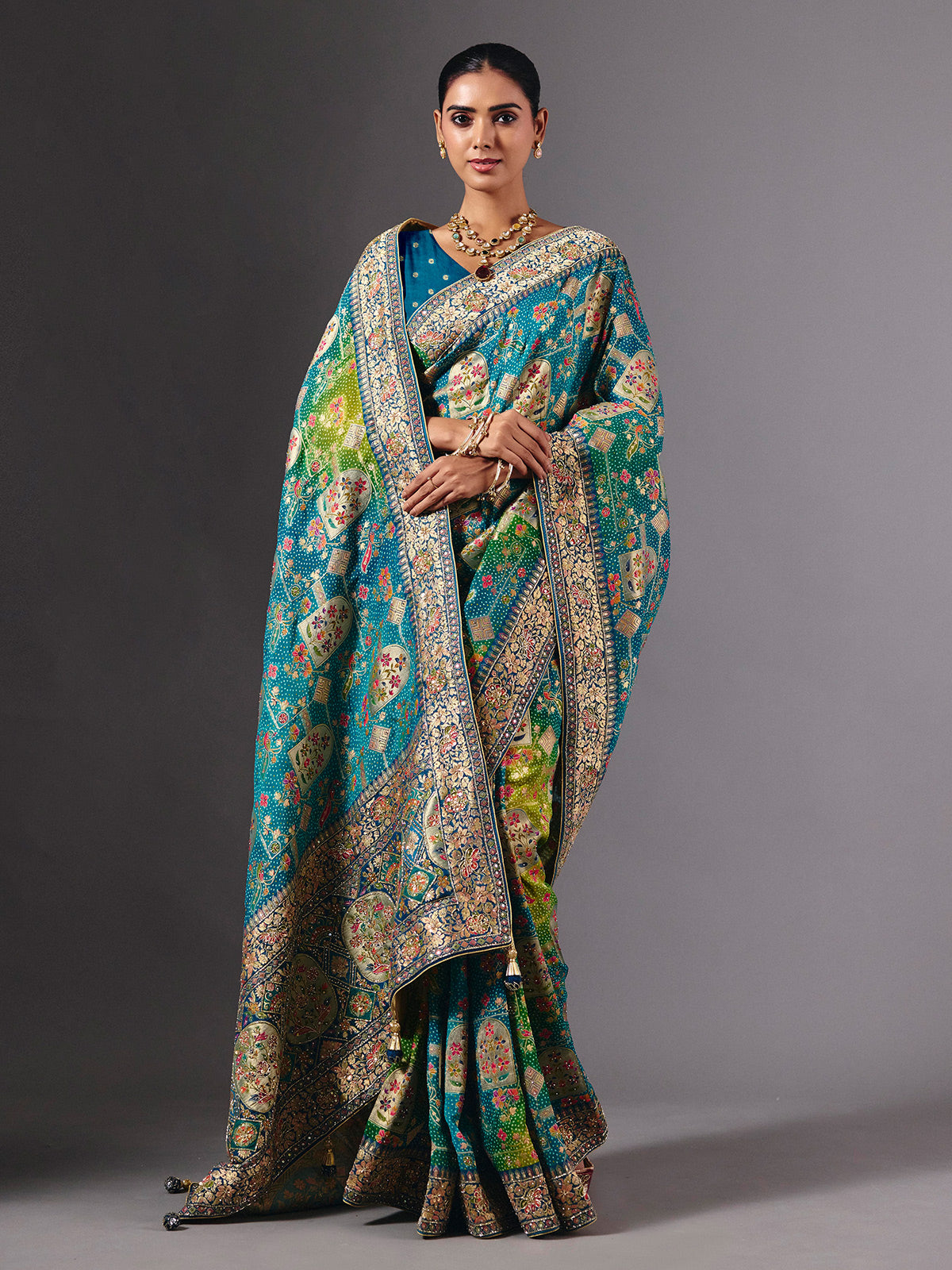 Blue dola silk saree with elegant peacock motif embellishments