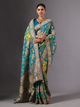 Blue dola silk saree with elegant peacock motif embellishments