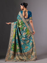 Blue dola silk saree with elegant peacock motif embellishments