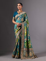 Blue dola silk saree with elegant peacock motif embellishments