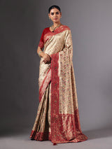 Beige shimmer dola silk saree with floral zari artistry