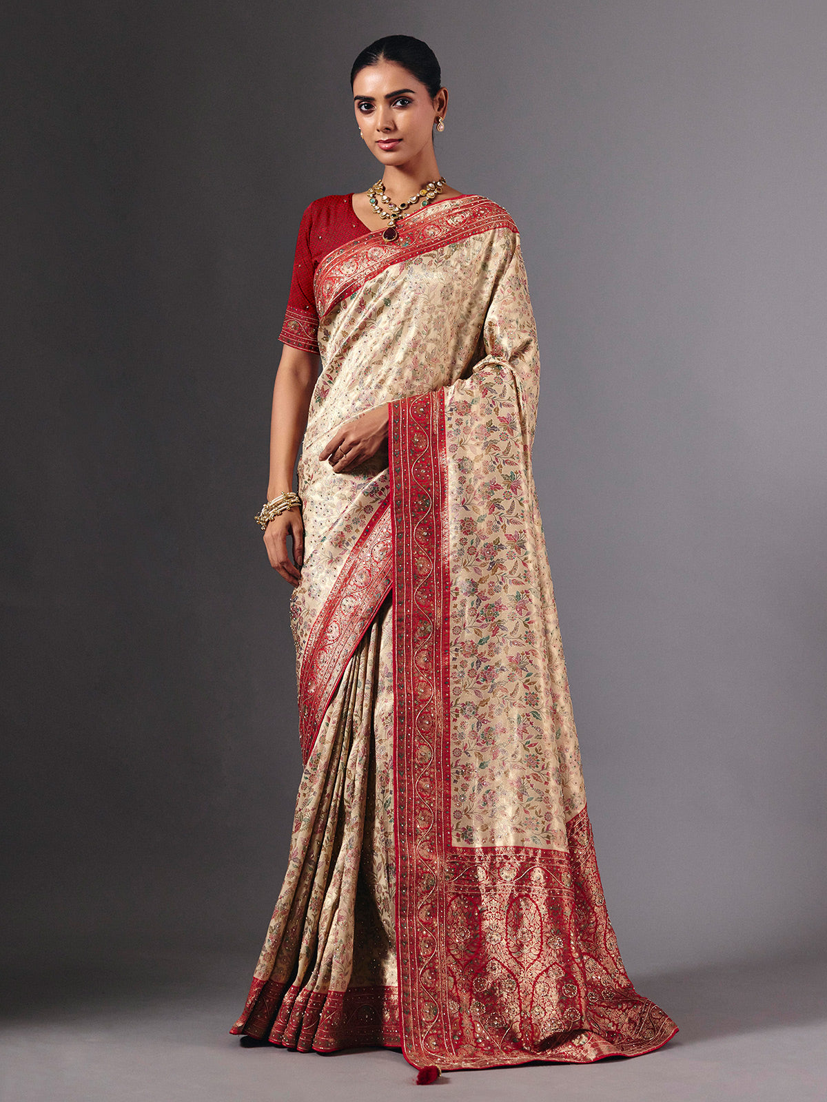 Beige shimmer dola silk saree with floral zari artistry