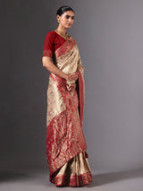 Beige shimmer dola silk saree with floral zari artistry