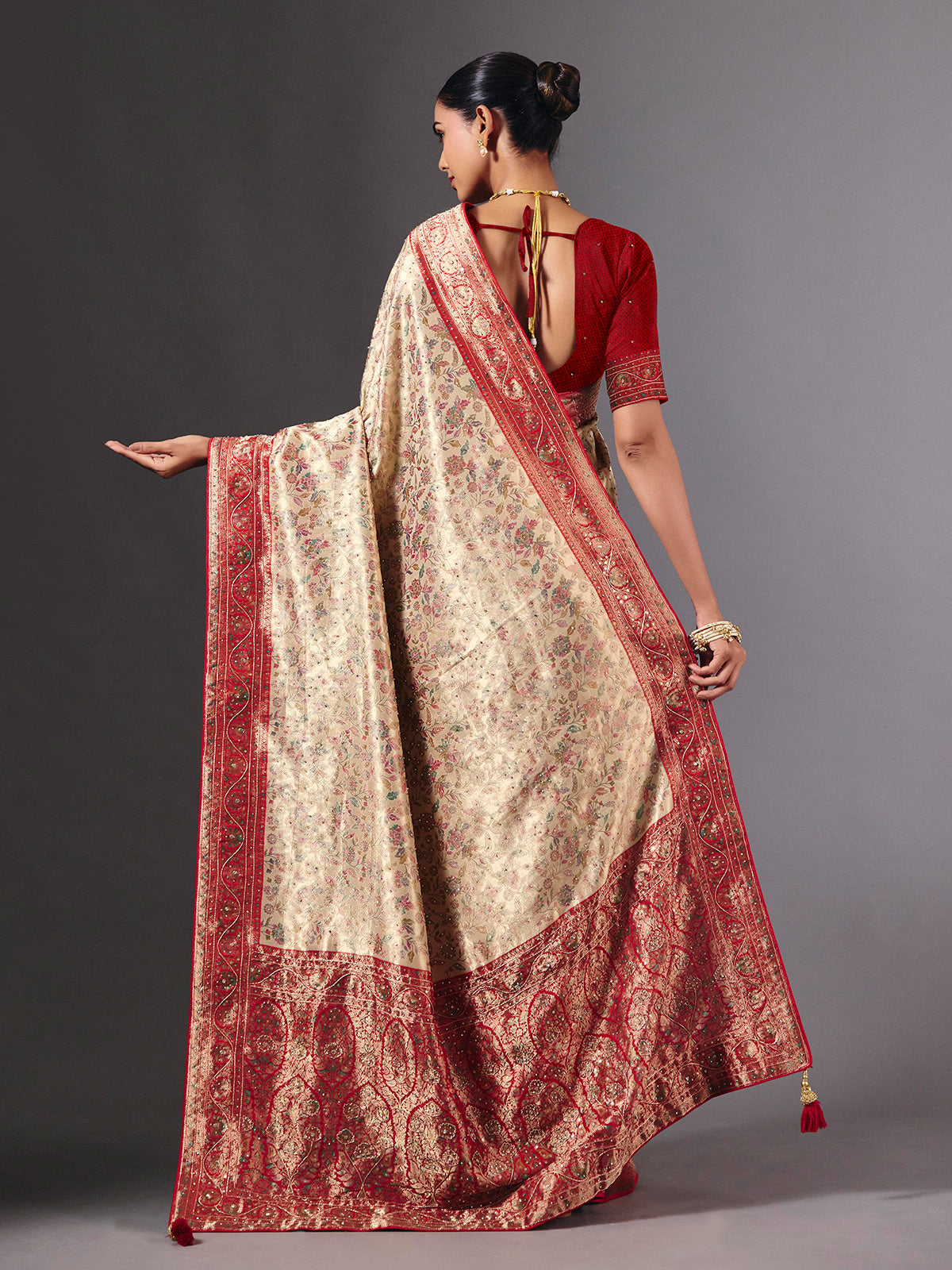 Beige shimmer dola silk saree with floral zari artistry