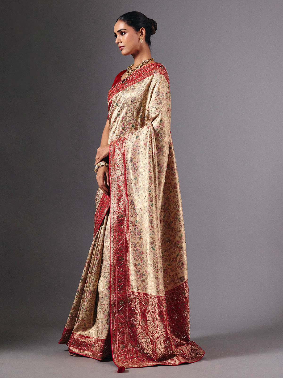 Beige shimmer dola silk saree with floral zari artistry