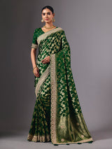Green satin silk saree with ornate zari tassel detailing