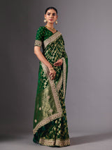Green satin silk saree with ornate zari tassel detailing