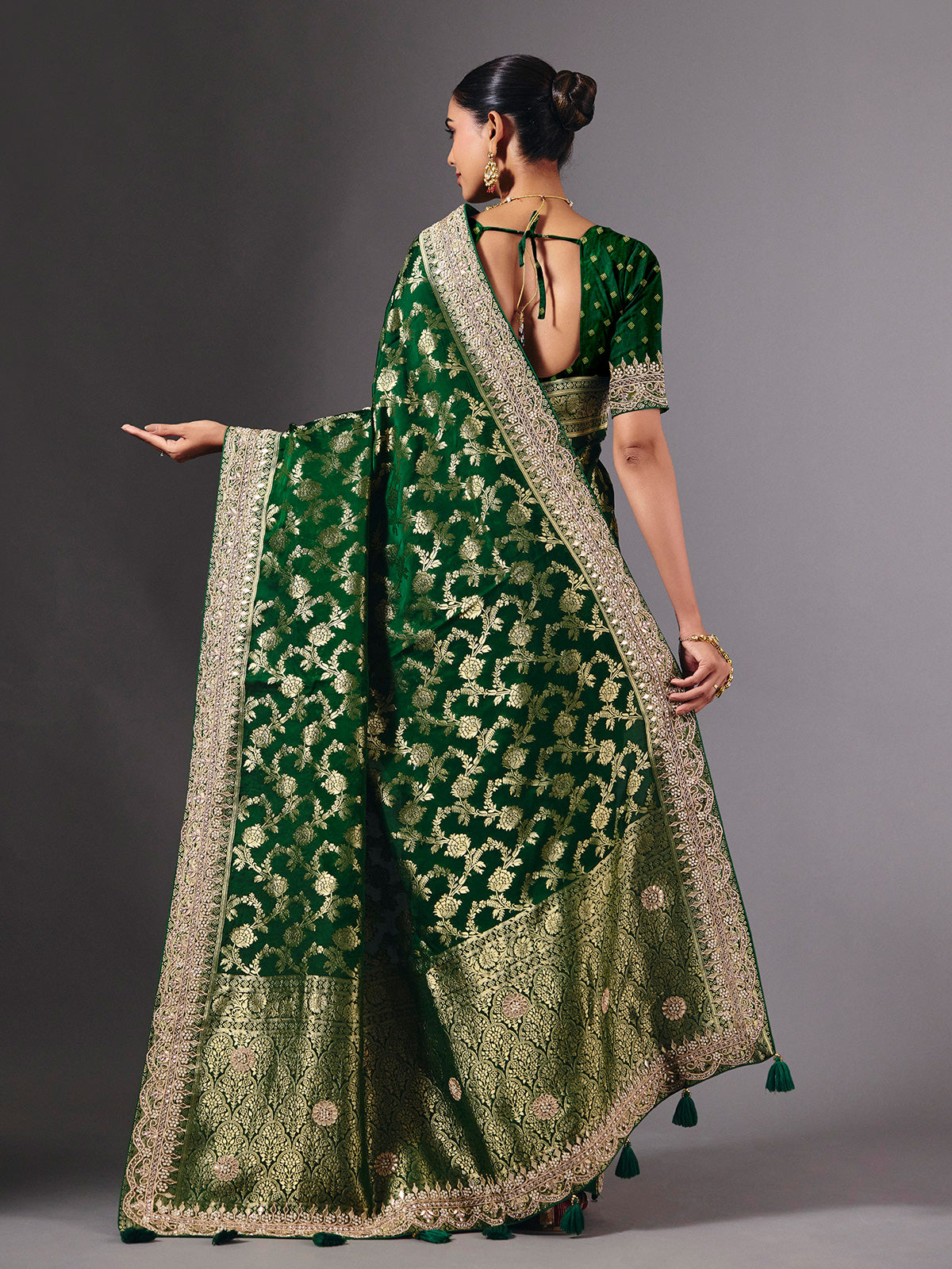 Green satin silk saree with ornate zari tassel detailing