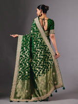 Green satin silk saree with ornate zari tassel detailing