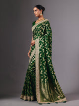 Green satin silk saree with ornate zari tassel detailing