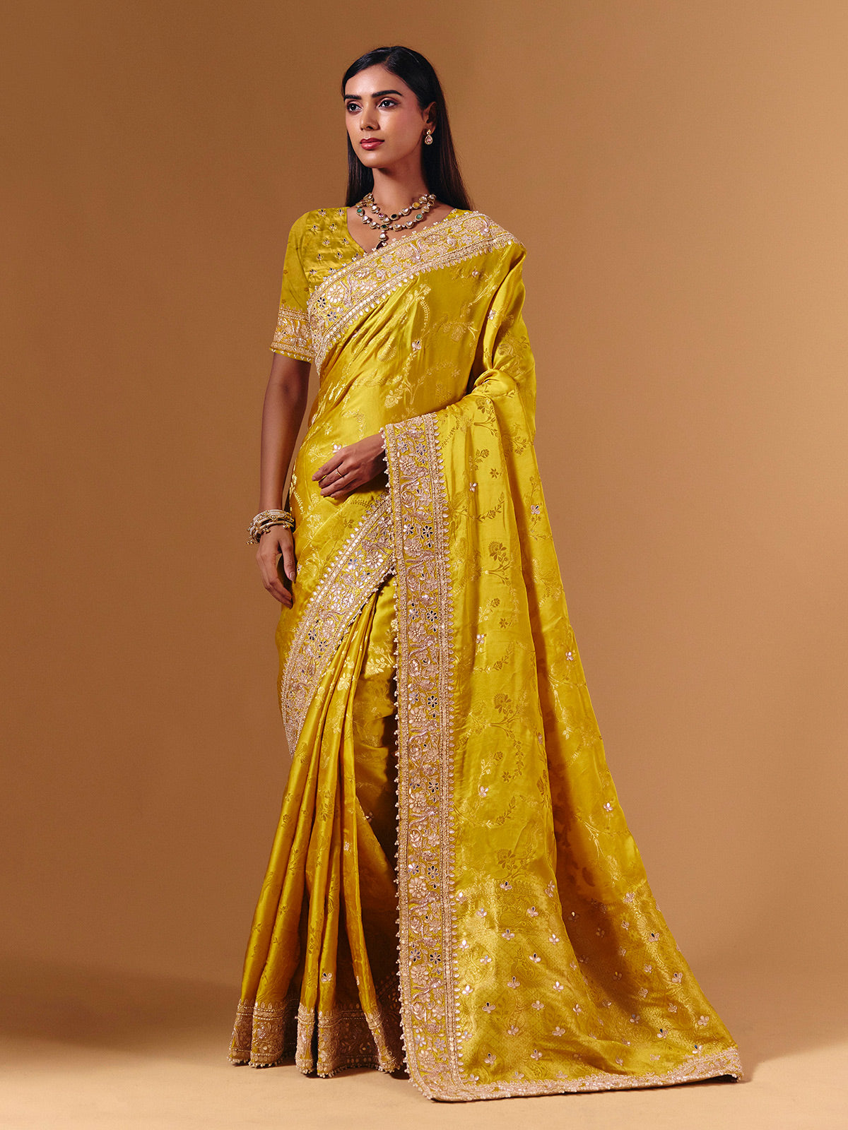 Yellow satin silk saree with elegant mirror zari artistry