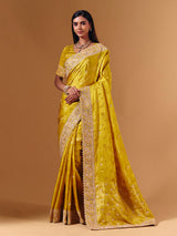 Yellow satin silk saree with elegant mirror zari artistry