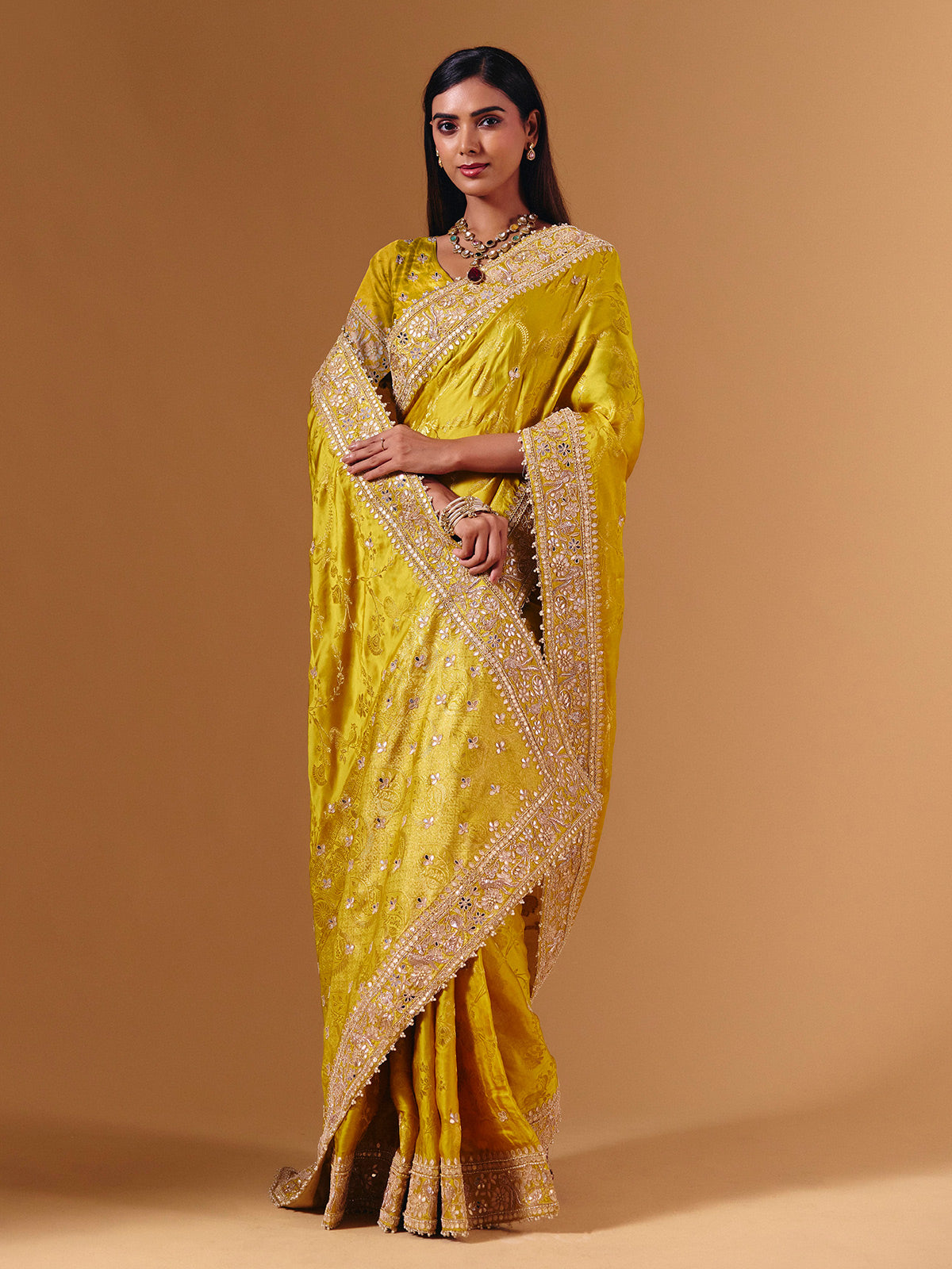 Yellow satin silk saree with elegant mirror zari artistry