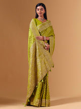 Bright green modal silk saree with dazzling zari detailing