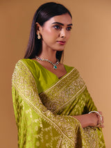 Bright green modal silk saree with dazzling zari detailing