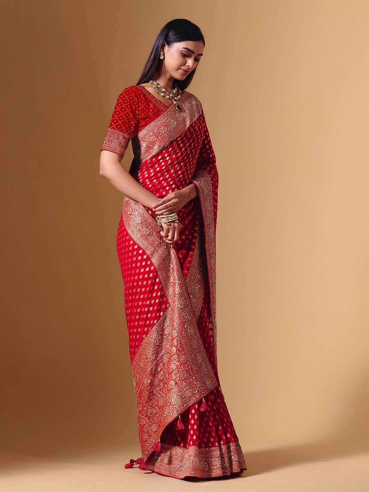 Red dola silk saree with exquisite zari butti embellishments