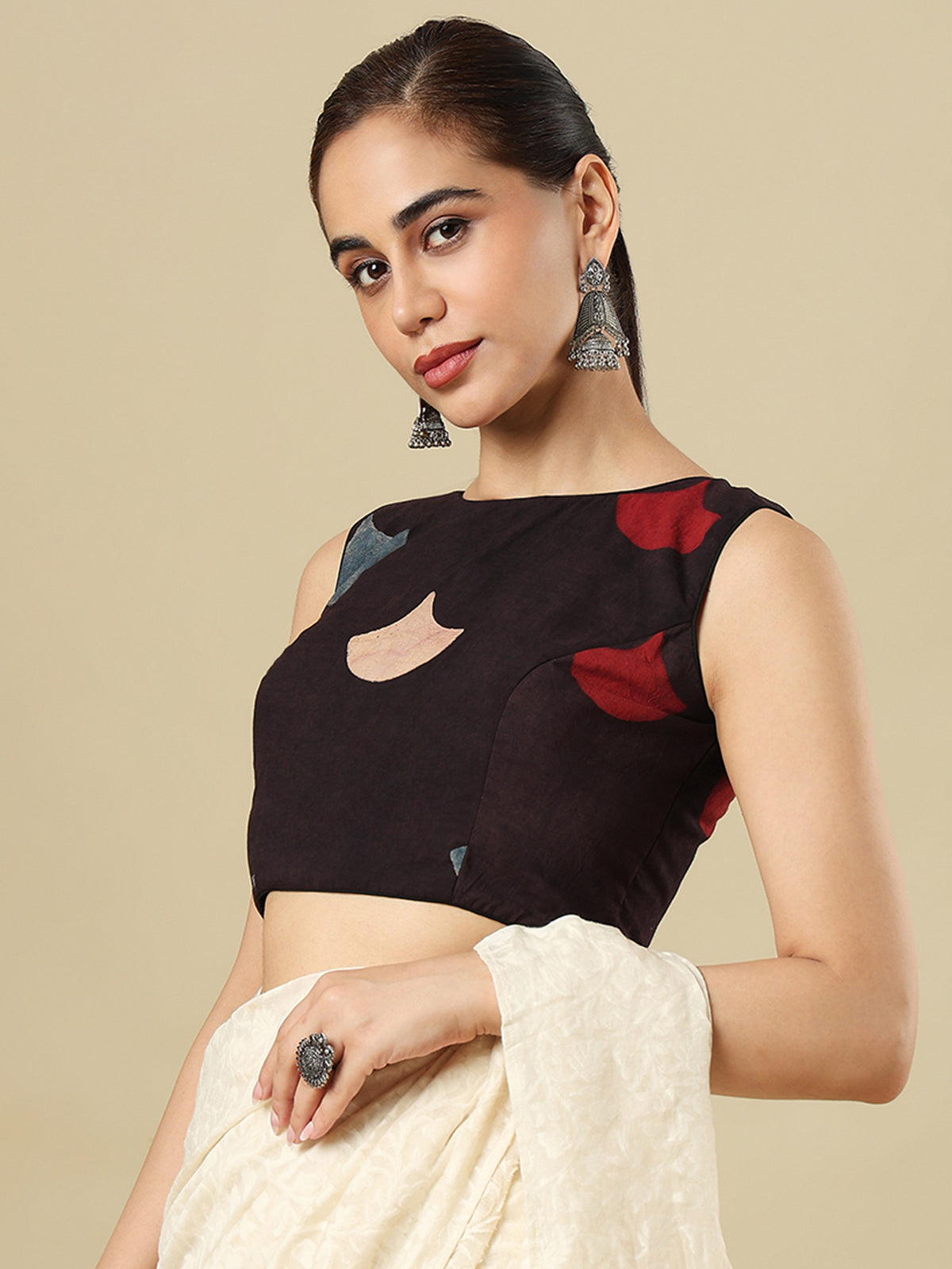 Black cotton printed blouse with boat neckline and sleeveless styling