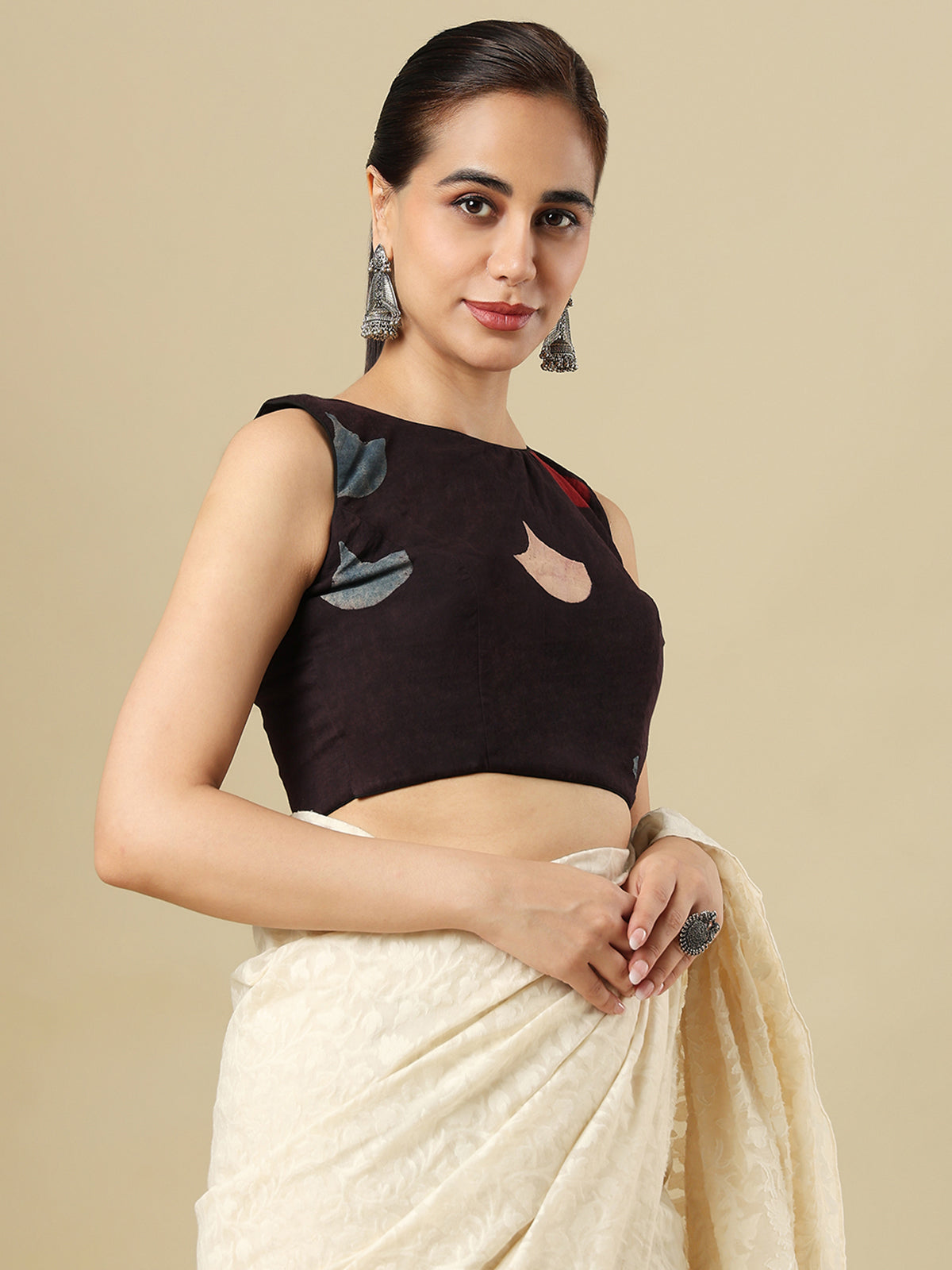 Black cotton printed blouse with boat neckline and sleeveless styling