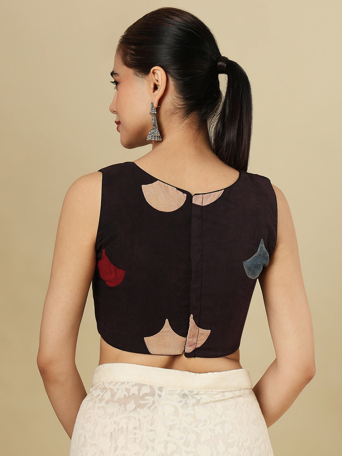 Black cotton printed blouse with boat neckline and sleeveless styling