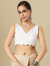 White linen solid blouse with V neck and sleeveless silhouette