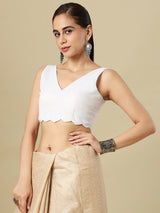White linen solid blouse with V neck and sleeveless silhouette