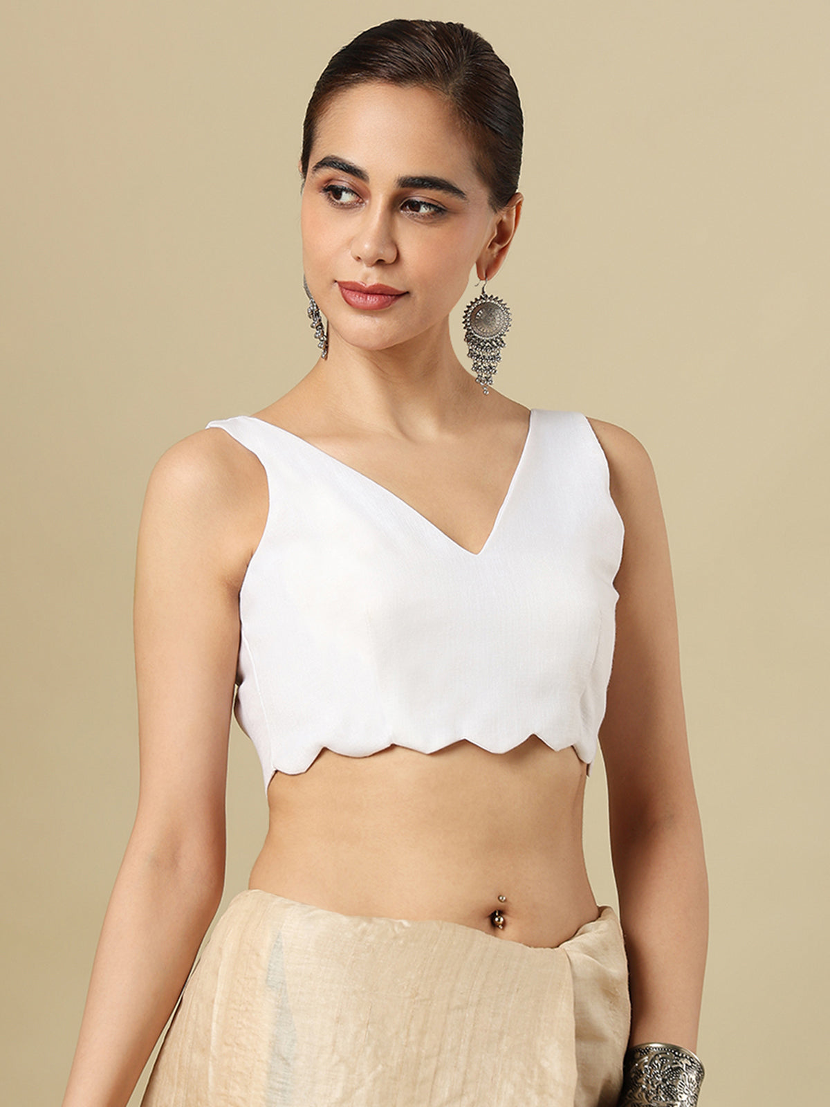 White linen solid blouse with V neck and sleeveless silhouette